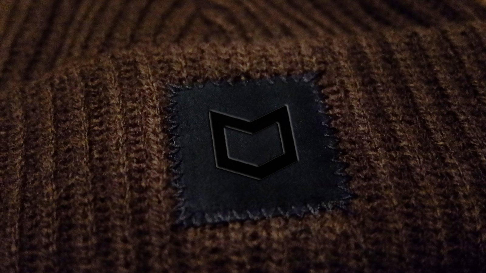 hat with embedded icon logo